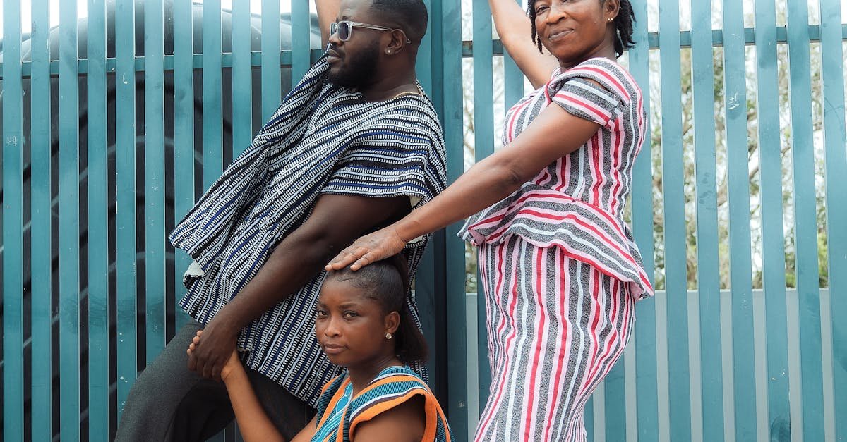 Elegant group wearing vibrant African fugu outfits, beautifully posing in Accra, Ghana.